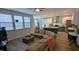 Open concept living room and kitchen with stainless steel appliances at 101 Clardona Way, Holly Springs, NC 27540