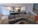 Spacious living space that opens to the kitchen with stainless-steel appliances and center island at 101 Clardona Way, Holly Springs, NC 27540