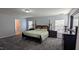 Spacious main bedroom boasts large windows, neutral color scheme, and plenty of natural light at 101 Clardona Way, Holly Springs, NC 27540