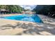 A beautiful community pool offers a refreshing escape on a sunny day with a clubhouse nearby at 101 Clardona Way, Holly Springs, NC 27540