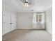 Simple bedroom with double doors and window at 1201 Enderbury Dr, Raleigh, NC 27614