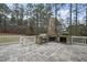 Stone patio with built-in grill and fireplace at 1201 Enderbury Dr, Raleigh, NC 27614