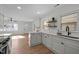 Modern kitchen with white cabinets and quartz countertops at 1805 Pritchard Pl, Durham, NC 27707