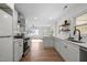 Modern kitchen with white cabinets and quartz countertops at 1805 Pritchard Pl, Durham, NC 27707