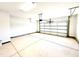 Spacious, clean two-car garage featuring an automatic door opener and ample space for storage at 211 Drayton Hall Ln, Sanford, NC 27330