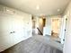 Open upstairs hallway with access to bedrooms, bathrooms, and carpet throughout at 211 Drayton Hall Ln, Sanford, NC 27330