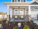 Inviting front porch with stone accents and seating at 490 Mallard Loop Dr, Clayton, NC 27527