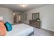 Well lit carpeted bedroom with neutral walls at 69 Streamline Ct, Lillington, NC 27546
