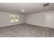 Large carpeted bonus room with neutral paint and natural light at 69 Streamline Ct, Lillington, NC 27546
