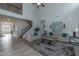 Inviting living room with a view of the staircase and plenty of natural light at 69 Streamline Ct, Lillington, NC 27546