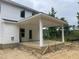 Unfinished patio with white support columns, perfect for outdoor entertaining and relaxation at 69 Streamline Ct, Lillington, NC 27546