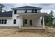 White siding home with an unfinished patio, ready for customization at 69 Streamline Ct, Lillington, NC 27546