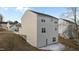 Three-story house exterior with vinyl siding, showing side and rear at 7041 Spanglers Spring Way, Raleigh, NC 27610