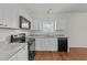 Modern kitchen with white cabinets and granite countertops at 7041 Spanglers Spring Way, Raleigh, NC 27610