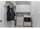 Laundry room with washer, dryer, and cabinets at 8117 Bud Morris Rd, Wake Forest, NC 27587