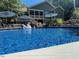 Inviting blue pool with a view of the home's back at 8117 Bud Morris Rd, Wake Forest, NC 27587