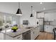 Modern kitchen with a large island and stainless steel appliances at 1012 Westerland Way # 201, Durham, NC 27703