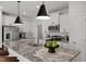 Modern kitchen boasts granite island and stainless steel appliances at 1034 Westerland Way # 210, Durham, NC 27703