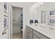 This bathroom has a double sink vanity, a tub and shower with a blue curtain at 111 Vili Dr, Broadway, NC 27505