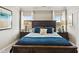 Elegant main bedroom with a dark wood bed frame, decorative pillows, and bedside tables at 111 Vili Dr, Broadway, NC 27505