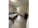 This staged bedroom features plank flooring, paint, and decor at 1118 Jackson St, Burlington, NC 27217