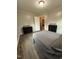 This staged bedroom features plank flooring, paint, and decor at 1118 Jackson St, Burlington, NC 27217