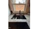 Modern kitchen sink under window with decor, granite countertop and faucet at 1118 Jackson St, Burlington, NC 27217