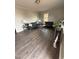 Living room featuring hardwood floors, neutral paint, two sofas and matching side tables at 1118 Jackson St, Burlington, NC 27217