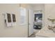 Bathroom featuring double sinks, white cabinets and countertops, and view to the bedroom at 113 Reagan Crest Dr, Clayton, NC 27520