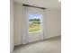 Bright bedroom with a large window offering great light and view of the outside at 113 Reagan Crest Dr, Clayton, NC 27520