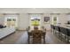 Open concept space with living and dining areas, featuring bright windows and modern design at 113 Reagan Crest Dr, Clayton, NC 27520