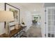 Entryway featuring a hardwood floor, white doors and a decorative table with orchids at 113 Reagan Crest Dr, Clayton, NC 27520