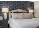 Comfortable bed with decorative pillows in a primary bedroom with modern wall art at 113 Reagan Crest Dr, Clayton, NC 27520