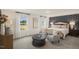 Stylish main bedroom featuring plush carpet, cozy seating, and natural light at 113 Reagan Crest Dr, Clayton, NC 27520