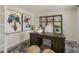 Office with a large desk, stylish decor, unique artwork, and a neutral rug at 113 Reagan Crest Dr, Clayton, NC 27520