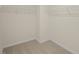 Empty walk-in closet with carpet and white wire shelving for storage at 113 Reagan Crest Dr, Clayton, NC 27520