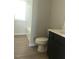Bright bathroom with a combination tub and shower and single sink at 120 Vili Dr, Broadway, NC 27505