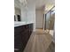 Modern bathroom featuring a double vanity and tiled shower with glass doors at 120 Vili Dr, Broadway, NC 27505