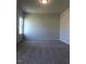 Spacious bedroom with neutral carpet and a large window providing natural light at 120 Vili Dr, Broadway, NC 27505