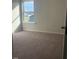 Cozy bedroom featuring plush carpeting and a window view at 120 Vili Dr, Broadway, NC 27505