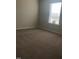 Carpeted bedroom with a window providing natural light at 120 Vili Dr, Broadway, NC 27505