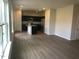 Living area displays modern vinyl flooring and an open concept layout connecting to the kitchen at 120 Vili Dr, Broadway, NC 27505