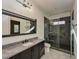Bathroom featuring a granite countertop, modern vanity, and frameless glass shower at 1425 Sky Vista Way, Raleigh, NC 27613