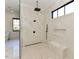 Elegant bathroom features a spacious glass shower with marble tile, black fixtures, and a window at 1425 Sky Vista Way, Raleigh, NC 27613