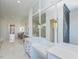 Bright bathroom with double sinks, white marble countertops, and expansive mirrors reflecting the open space at 1425 Sky Vista Way, Raleigh, NC 27613
