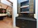 Stylish butler's pantry with black cabinetry, quartz countertops, and gold hardware at 1425 Sky Vista Way, Raleigh, NC 27613