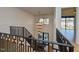 Elegant staircase with modern railing leading to the foyer, featuring a grand chandelier at 1425 Sky Vista Way, Raleigh, NC 27613