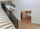 Spacious foyer featuring a modern staircase, chandelier, and views into the dining room at 1425 Sky Vista Way, Raleigh, NC 27613