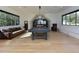 Large game room with a pool table, comfortable seating, and natural light from the large windows at 1425 Sky Vista Way, Raleigh, NC 27613