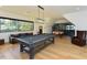 Game room featuring hardwood floors, a pool table, Foosball table, and comfortable seating at 1425 Sky Vista Way, Raleigh, NC 27613
